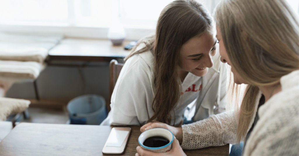 Two people chatting happily and compassionately with each other.