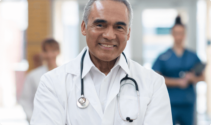 Smiling pain specialist looking at the camera.