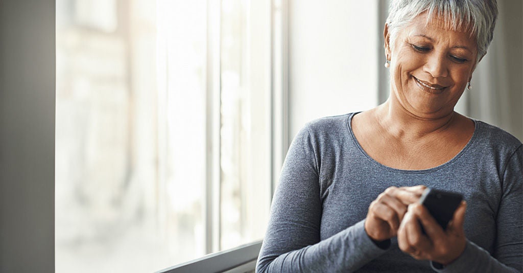 Woman relaxing while browsing her phone.