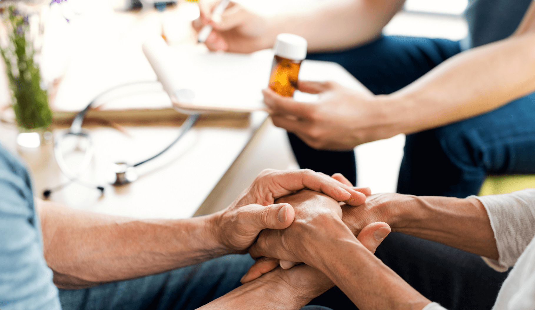 Doctor discussing pain medication options with a patient and their family.