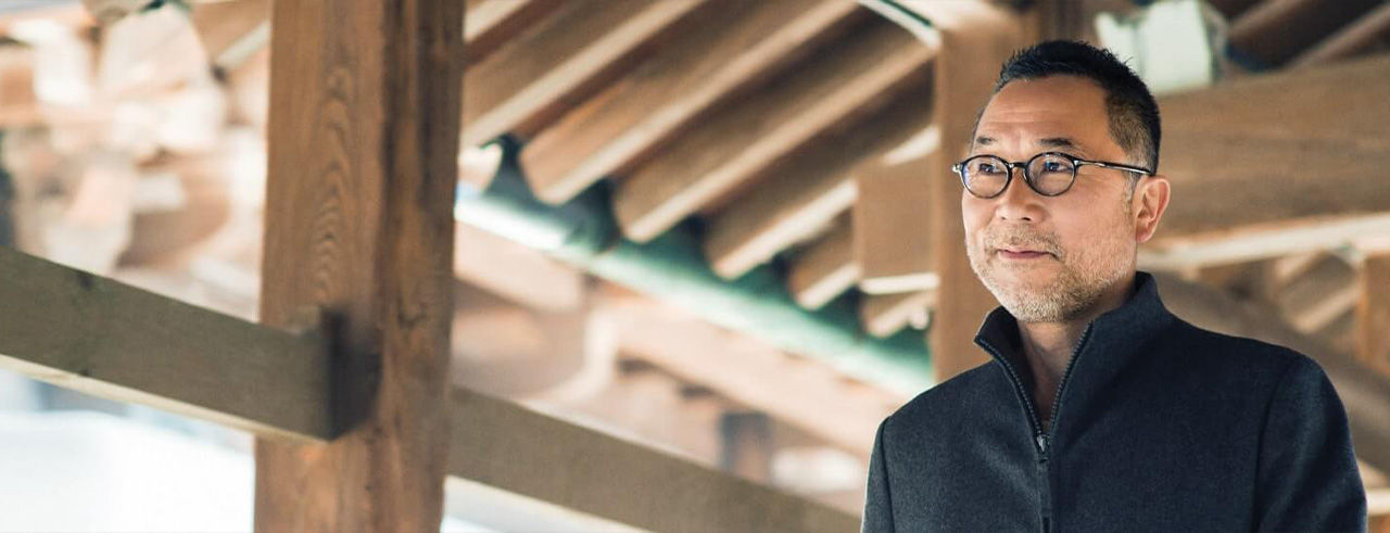 Smiling man with glasses.