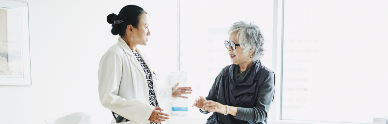 Pain specialist and patient discussing lower back pain management options.
