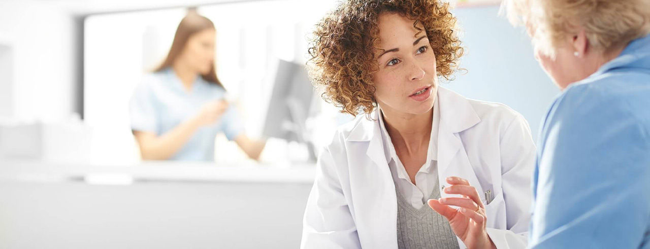 Doctor and patient talking with each other.